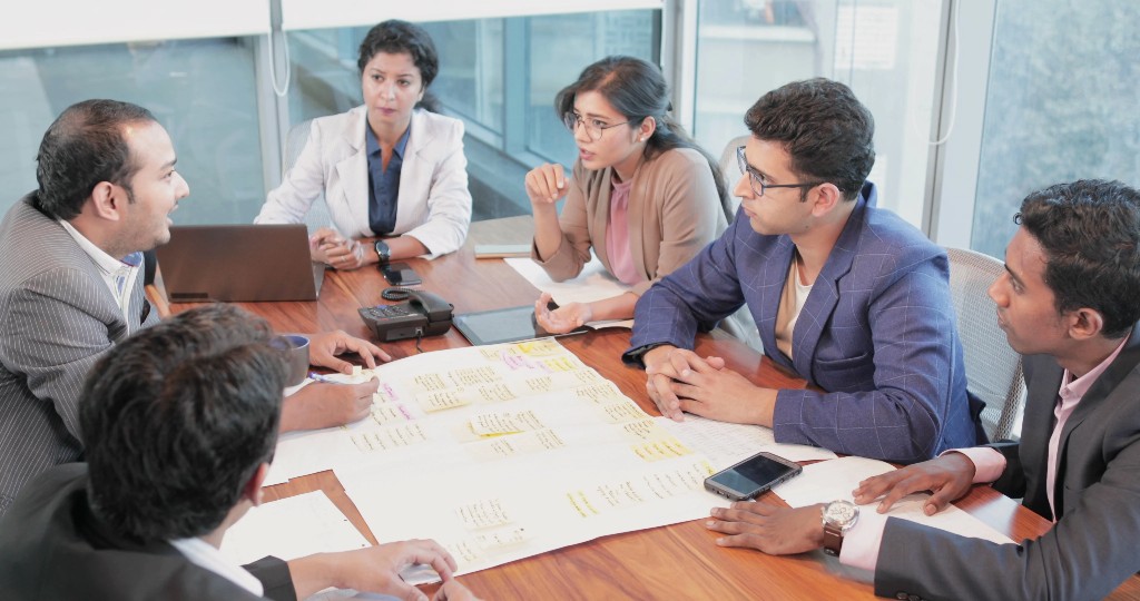 AVG consultants collaborating in a planning session